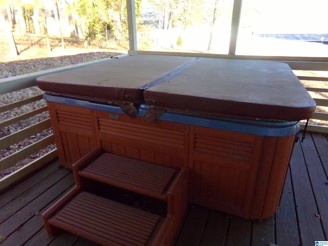 deck with a covered hot tub