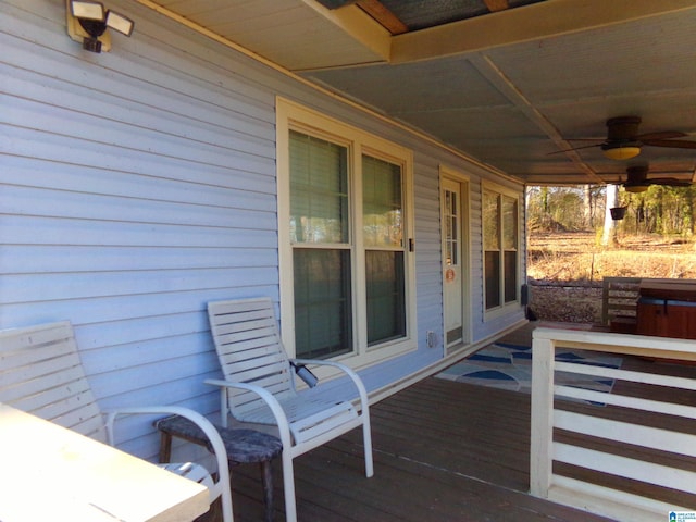 wooden terrace featuring ceiling fan and a porch