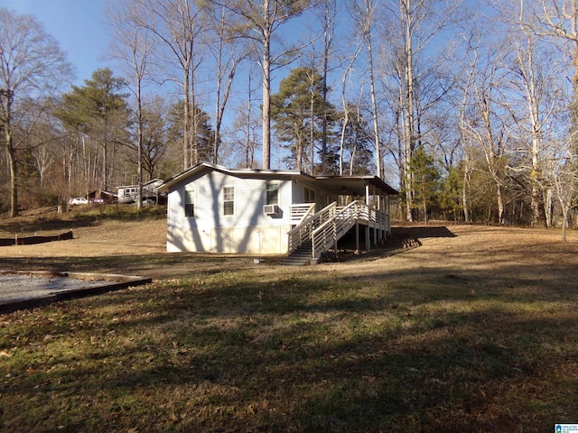 view of outbuilding featuring stairway