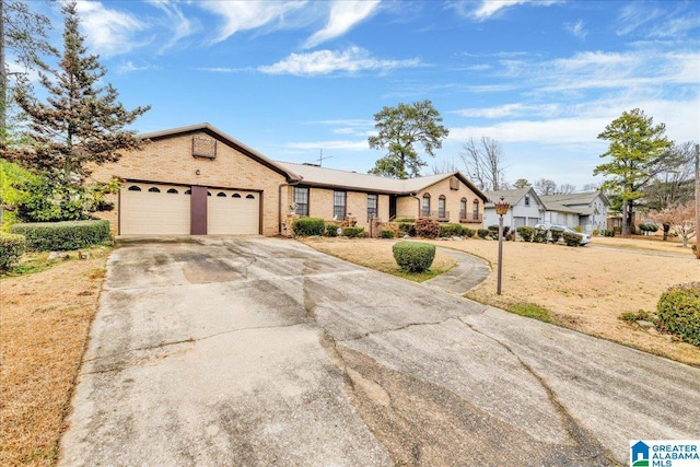 ranch-style house featuring a garage