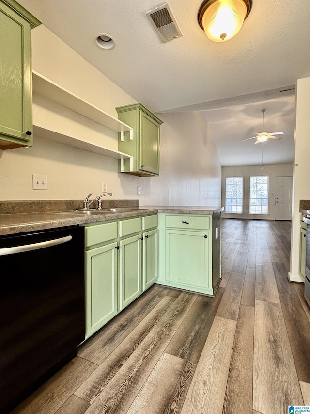 kitchen with dark hardwood / wood-style floors, dishwasher, sink, ceiling fan, and green cabinetry