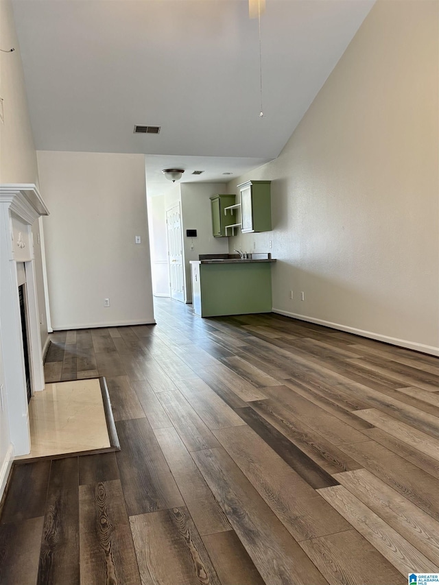 unfurnished living room featuring dark wood-type flooring