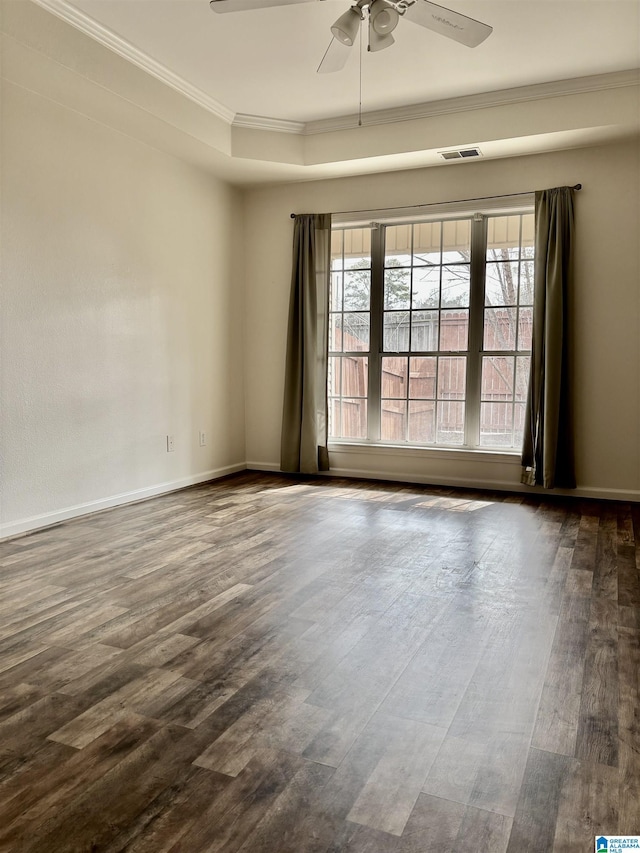 unfurnished room with dark wood-type flooring, ceiling fan, and ornamental molding