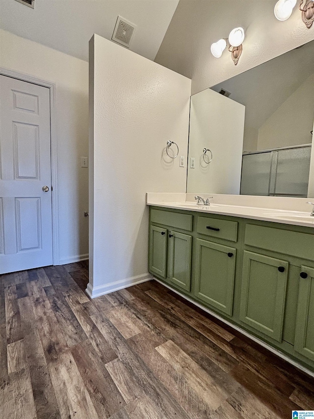 bathroom with hardwood / wood-style flooring and vanity