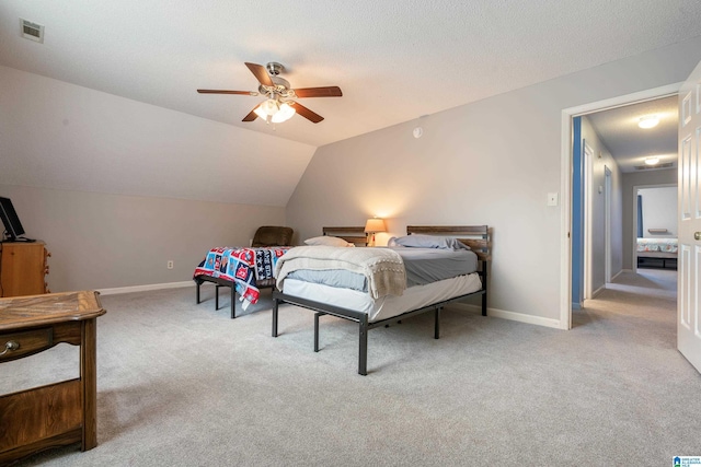 bedroom with lofted ceiling, light carpet, and ceiling fan