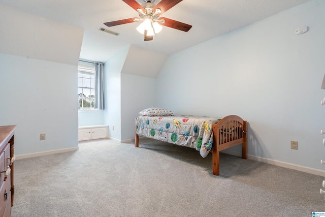 carpeted bedroom with ceiling fan and lofted ceiling