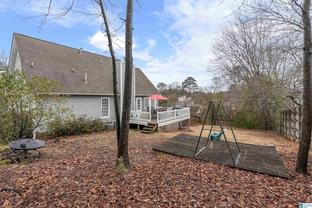 view of yard featuring a wooden deck and cooling unit