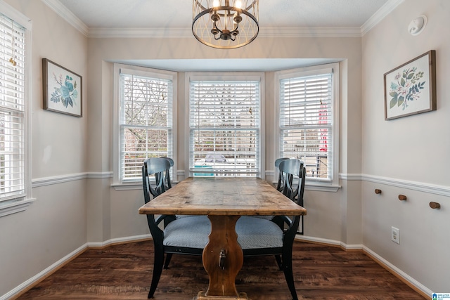 dining room featuring an inviting chandelier, dark hardwood / wood-style floors, and crown molding