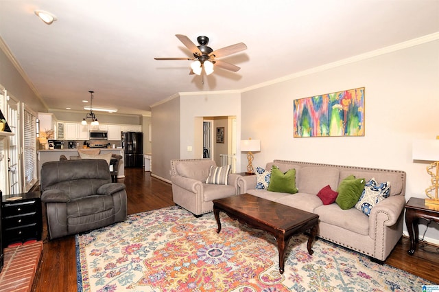 living room featuring dark hardwood / wood-style flooring, ornamental molding, and ceiling fan