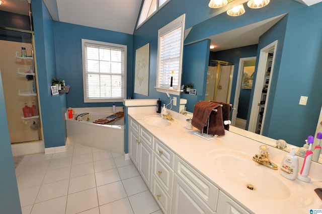 bathroom with tile patterned flooring, vanity, and shower with separate bathtub