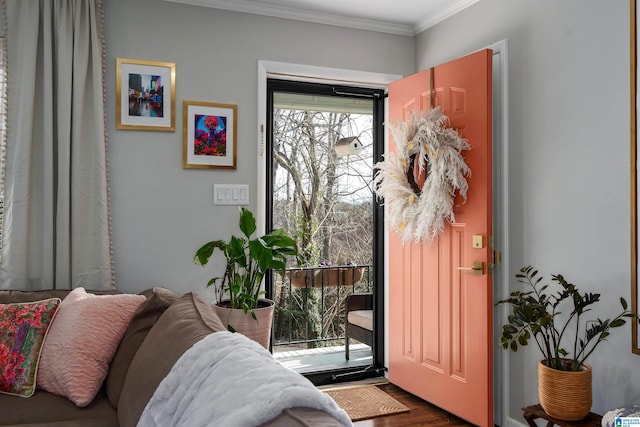 doorway with dark hardwood / wood-style flooring and ornamental molding