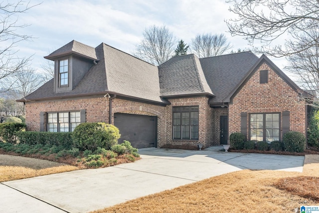 french provincial home with a garage