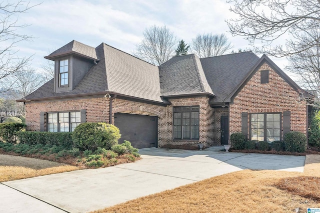 french country inspired facade featuring a garage