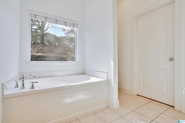 bathroom featuring tile patterned floors and a bathtub