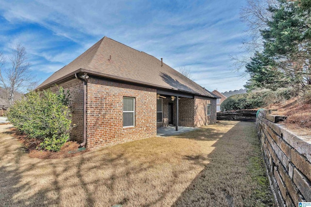 view of property exterior featuring a lawn