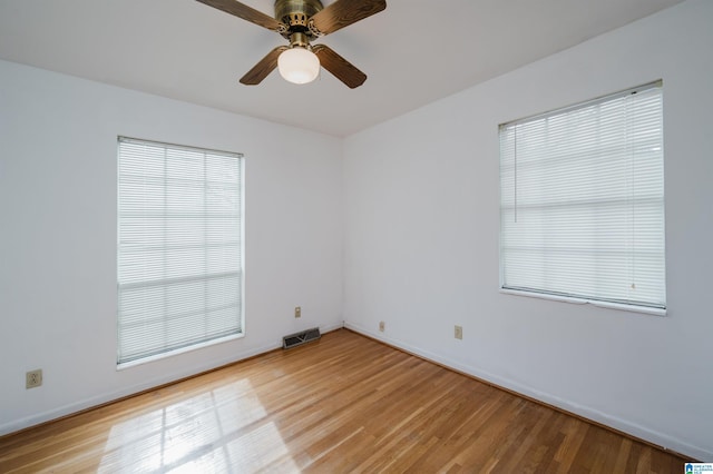 spare room featuring ceiling fan and light hardwood / wood-style floors