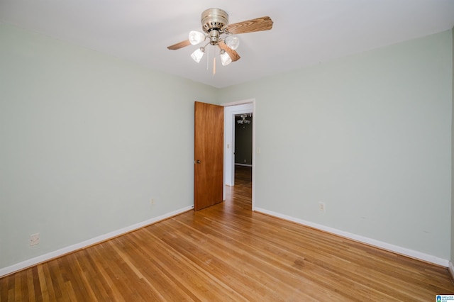 unfurnished room featuring ceiling fan and light wood-type flooring