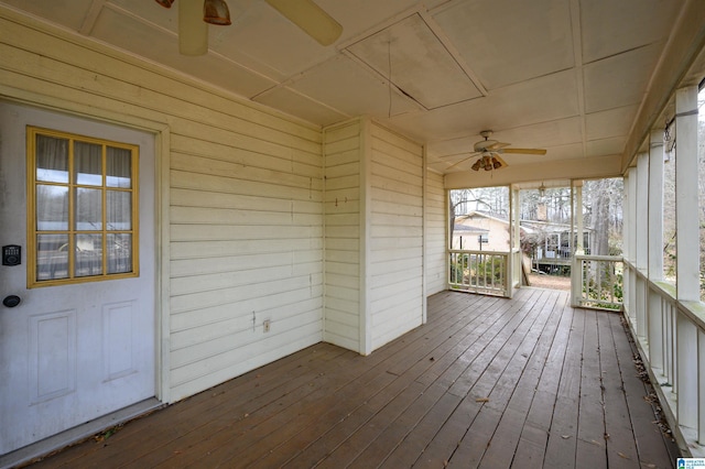 wooden deck with ceiling fan and a porch