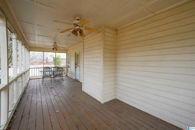 wooden terrace featuring ceiling fan