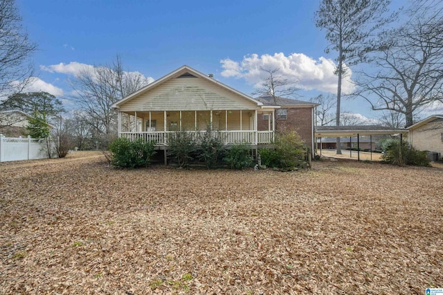 view of front facade featuring a porch and a carport