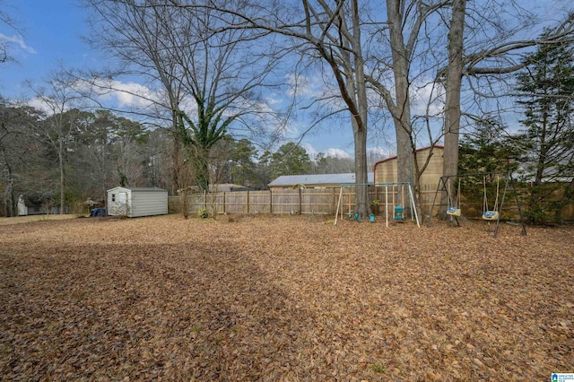 view of yard featuring a shed and a playground