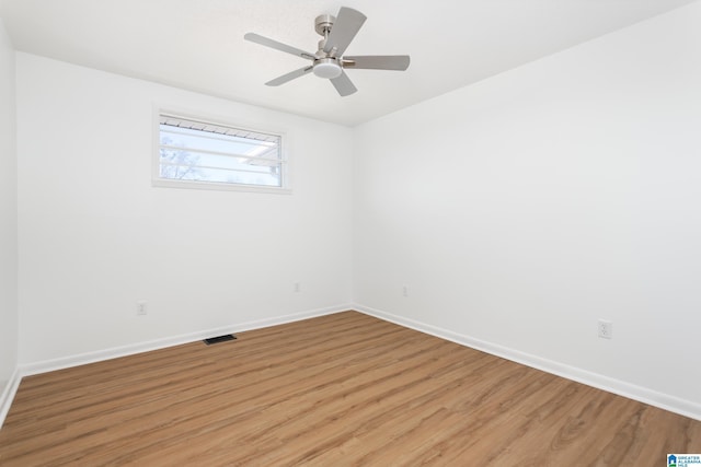 spare room with ceiling fan and hardwood / wood-style floors