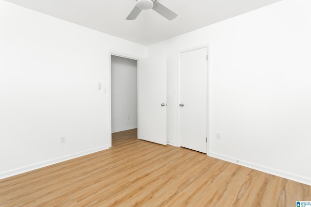 unfurnished bedroom featuring ceiling fan and light wood-type flooring