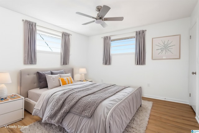 bedroom featuring ceiling fan and light hardwood / wood-style flooring