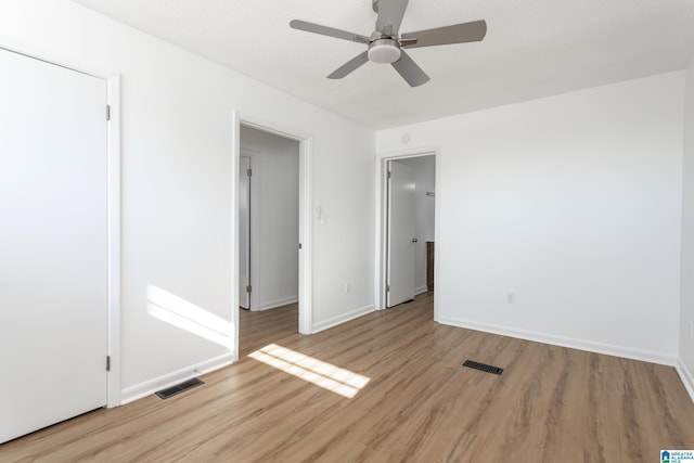 unfurnished bedroom featuring ceiling fan and light wood-type flooring