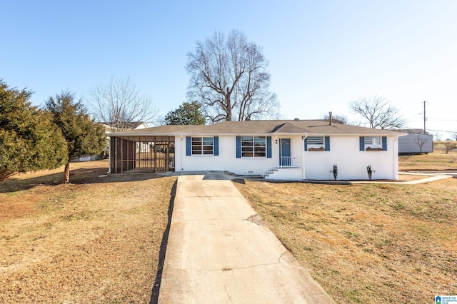 single story home with a carport and a front yard