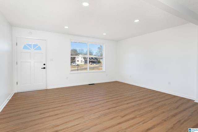 foyer entrance with light wood-type flooring