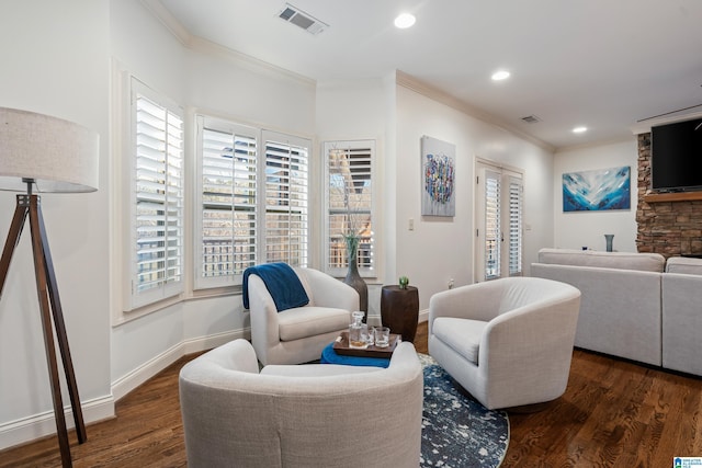 living room with dark wood-type flooring and ornamental molding