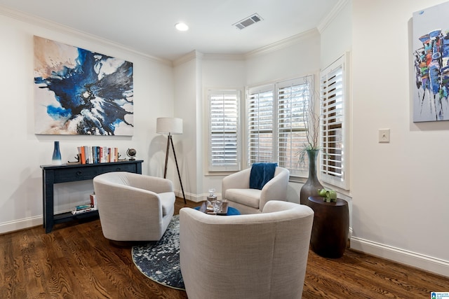 sitting room featuring dark wood-type flooring and ornamental molding