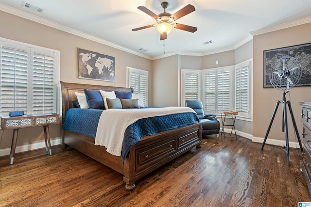 bedroom featuring dark wood-type flooring, ceiling fan, crown molding, and multiple windows