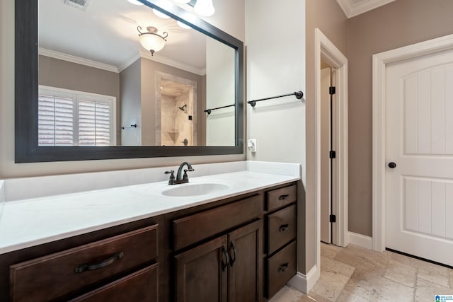 bathroom with ornamental molding, a shower, and vanity