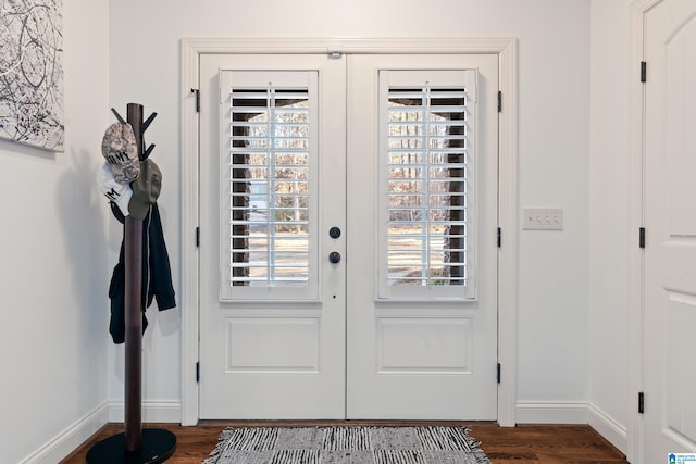 doorway to outside with french doors, plenty of natural light, and dark hardwood / wood-style flooring