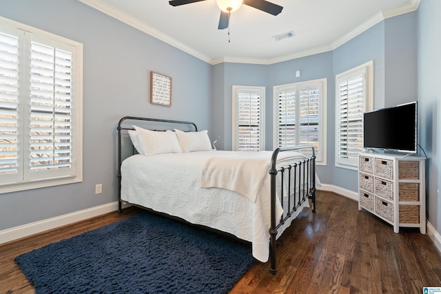 bedroom featuring ceiling fan, ornamental molding, and dark hardwood / wood-style floors