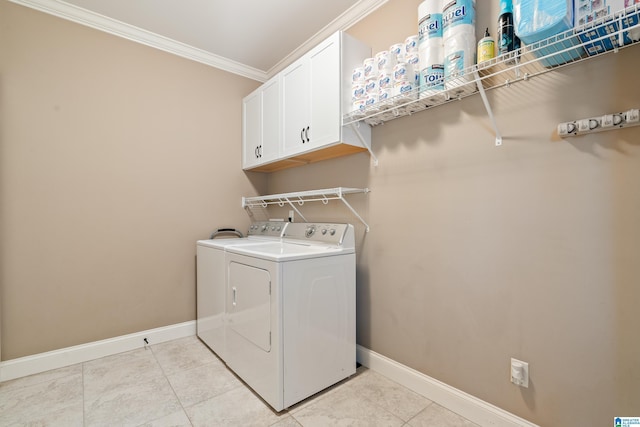 laundry area featuring cabinets, ornamental molding, washing machine and dryer, and light tile patterned floors