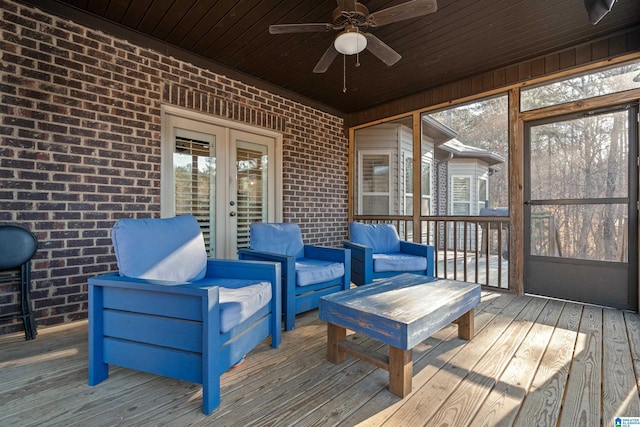 sunroom with plenty of natural light, wooden ceiling, french doors, and ceiling fan