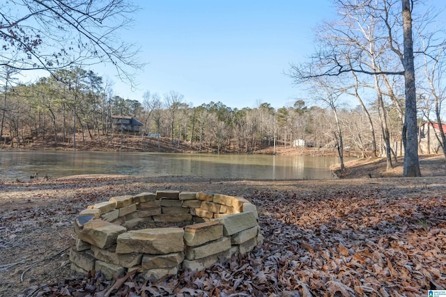 property view of water with an outdoor fire pit