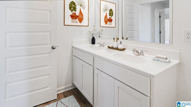 bathroom with vanity and hardwood / wood-style floors