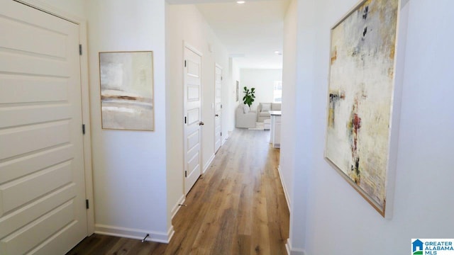 corridor with dark wood-type flooring