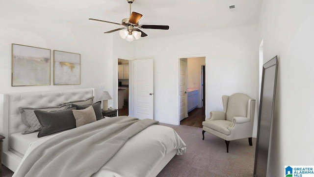 bedroom featuring dark carpet, connected bathroom, and ceiling fan