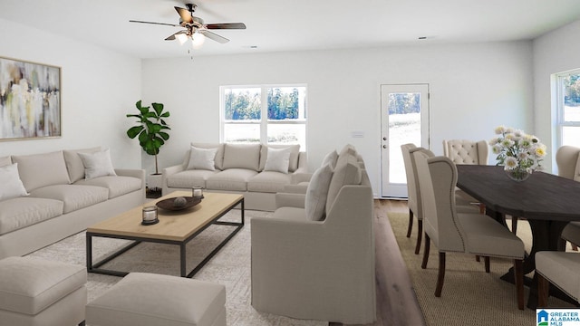 living room with ceiling fan and light hardwood / wood-style flooring