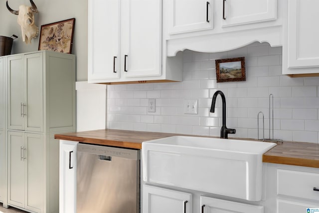 kitchen with wood counters, sink, tasteful backsplash, and dishwasher