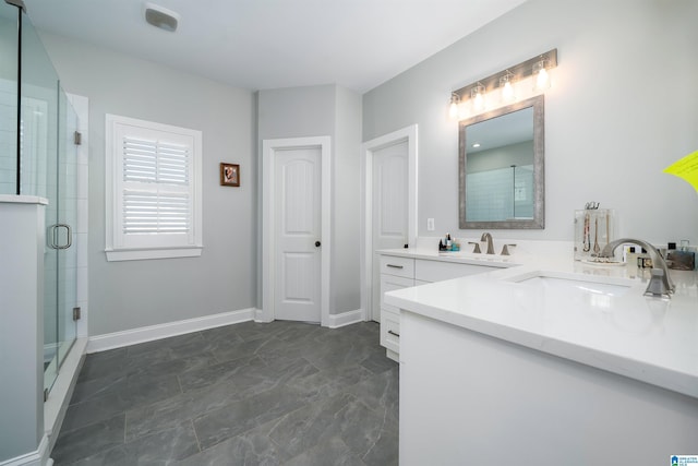 bathroom featuring vanity and an enclosed shower