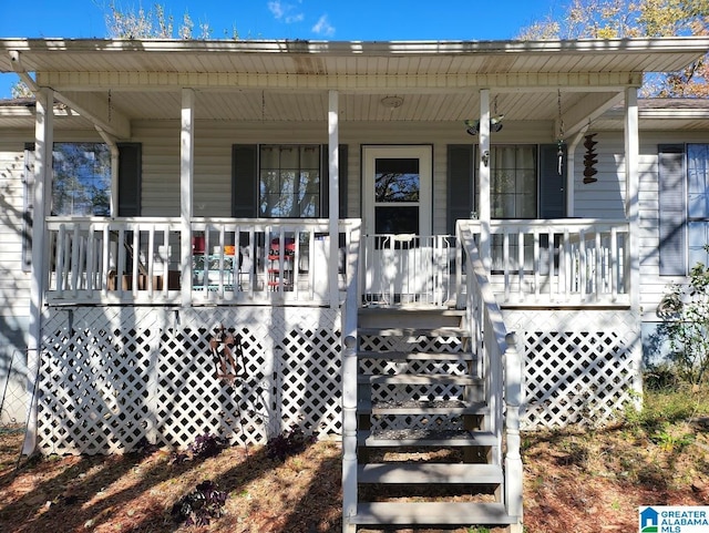 doorway to property featuring a porch