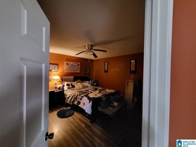 bedroom featuring ceiling fan and hardwood / wood-style floors