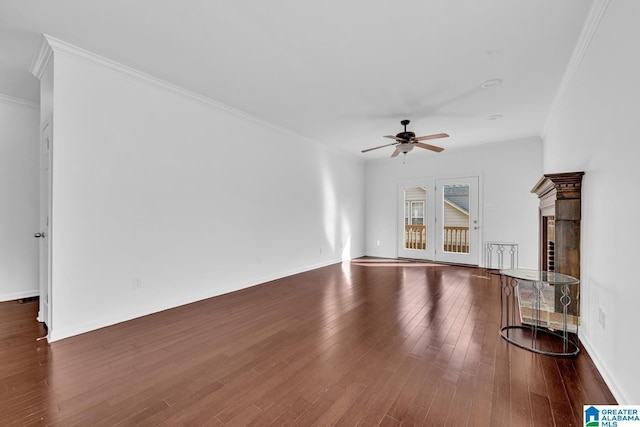 unfurnished living room with dark wood-type flooring, ceiling fan, and crown molding