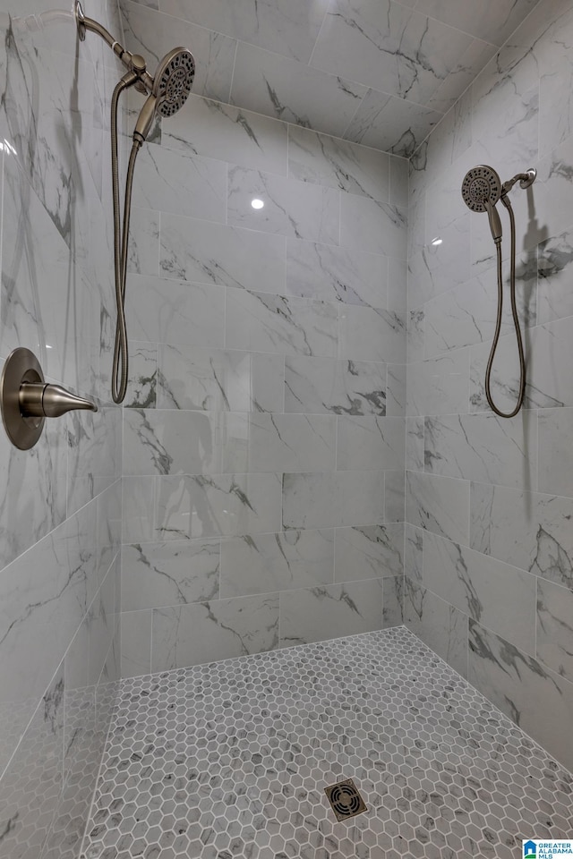 bathroom with a tile shower